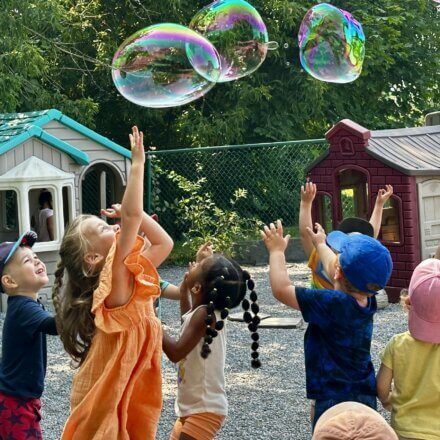 kids playing with bubbles